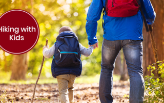 Adult and child walking with hiking sticks. text: Tips For Hiking With Kids