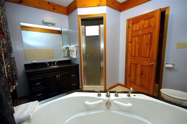 Stormont bathroom with shower and air jet tub